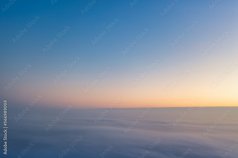 Yellow and blue dawn over clouds, concept, travel and leisure. Yellow and blue dawn over clouds, concept, travel and leisure.