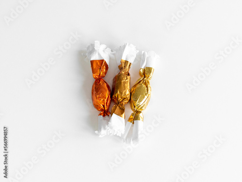 Three pieces of Hungarian Christmas candy called szaloncukor.