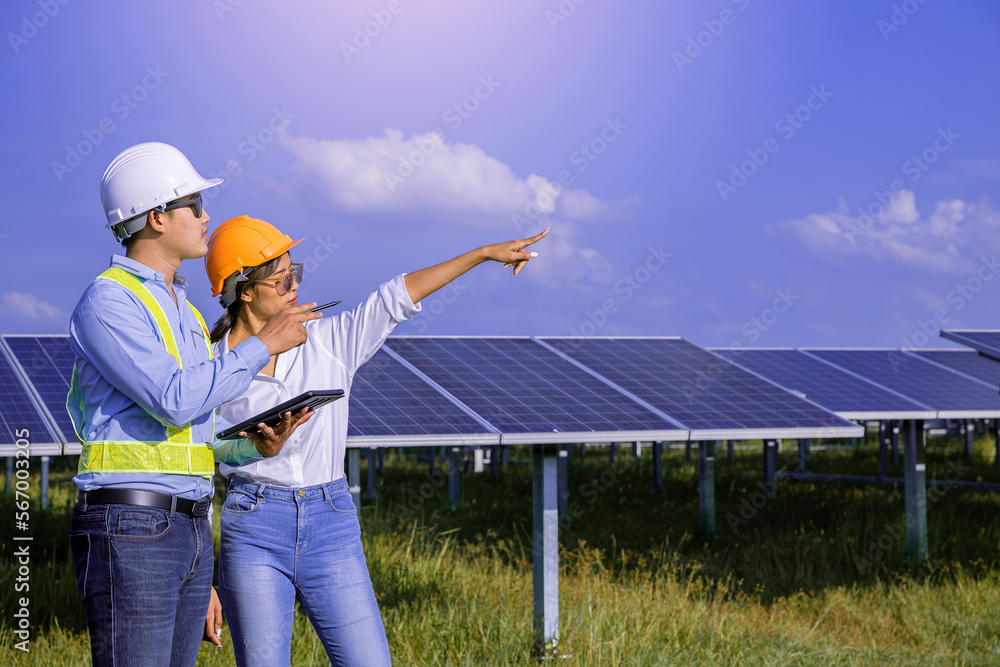 Electrical, instrument technician survey, checking, maintenance electric system at solar panel field in sunny day. Electrical, instrument technician survey, checking, maintenance electric system at solar panel field in sunny day.