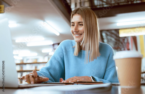 Photography Education, university and happy woman in library with laptop, research and books for school project or exam