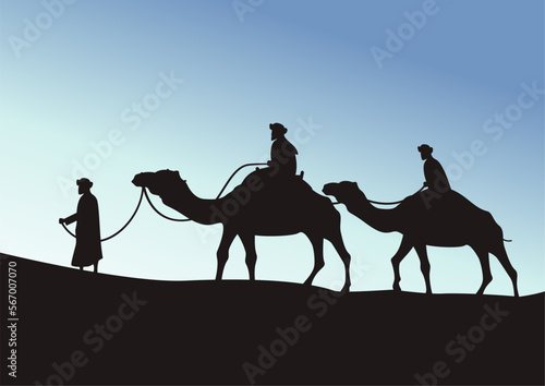 camel caravan going through the desert on beautiful blue sky