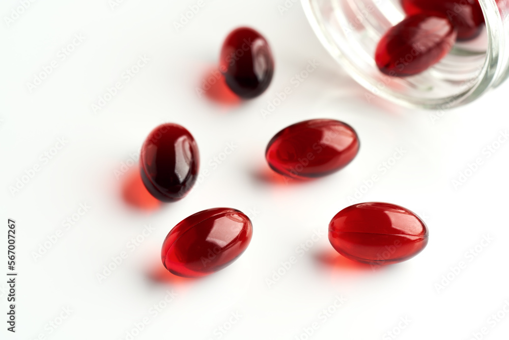 Krill oil capsules on a bright background - natural nutritional supplement Krill oil capsules on a bright background - natural nutritional supplement