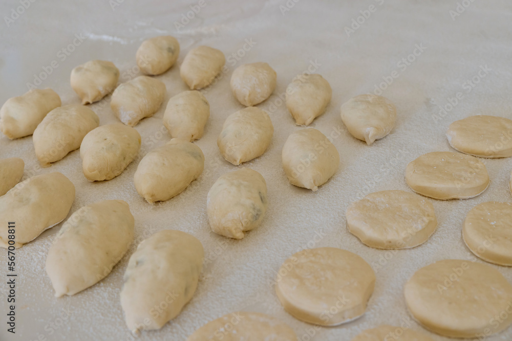 Preparation to baking bun with stuffing and donuts from yeast dough