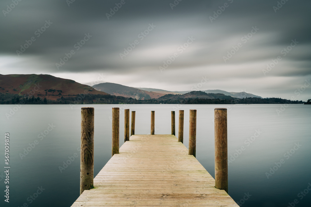Derwentwater Jetty near Keswick in the Lake District. Boat landing with still out of focus water. 