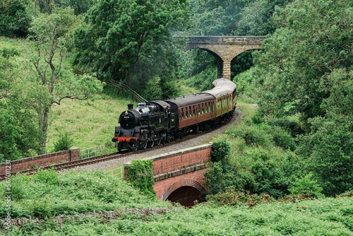 Steam train Locomotive travelling along the track on the North Yorkshire Moors Railway
