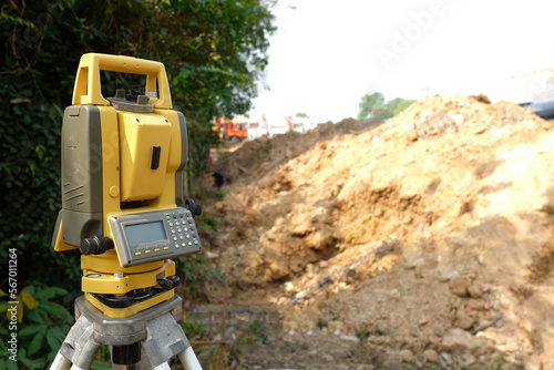 Survey instrument, Theodolite mounted on a tripod at a construction site