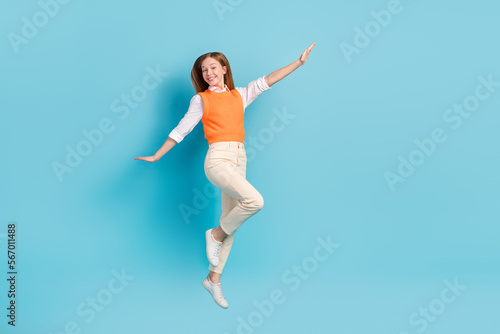 Full length photo of overjoyed lady wear stylish clothes rejoice summer holidays empty space isolated on blue color background © deagreez