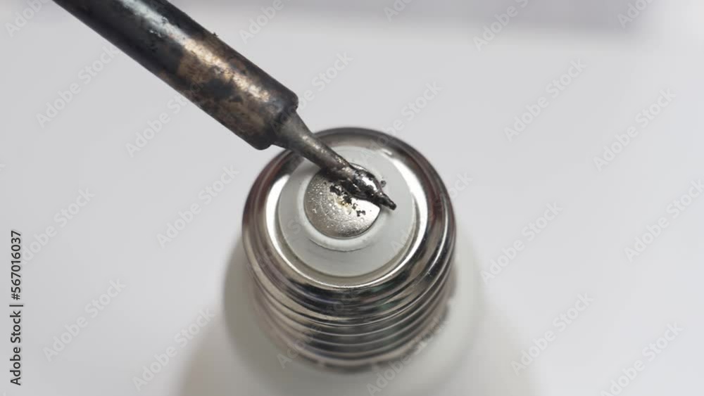 soldering iron and solder acid on the base of the lamp. Stock Video