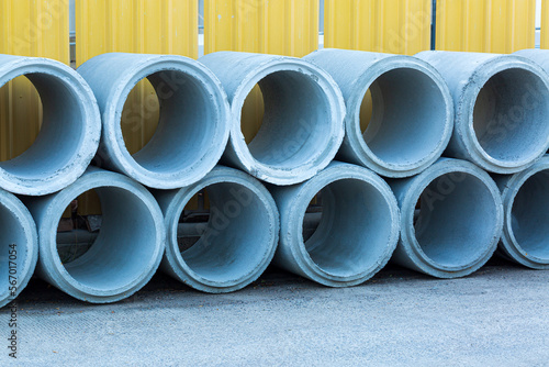 concrete drain,Concrete pipes at the construction site, Concrete pipes on building site. Blue sky,Concrete,Pipe - Tube,Drainage, Construction Site,Horizontal,Manufacturing,Engineering,