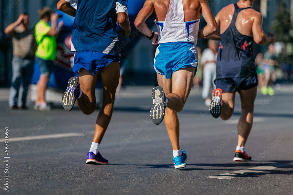 back three athletes runners run city marathon back three athletes runners run city marathon