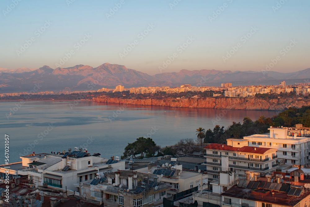 A red sunrise on the cliffs at Antalya Bay Turkey in January