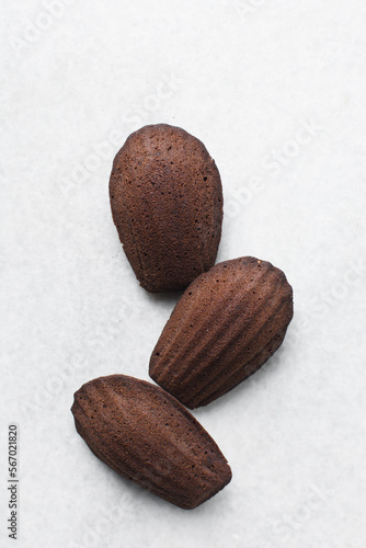 Принти на полотні Top view of Chocolate madeleines on a marble tray, plain chocolate madeleine cak