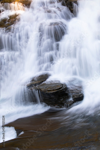 Beautiful cascading waterfall along Going to the Sun Road in Glacier National Park  Montana  United States