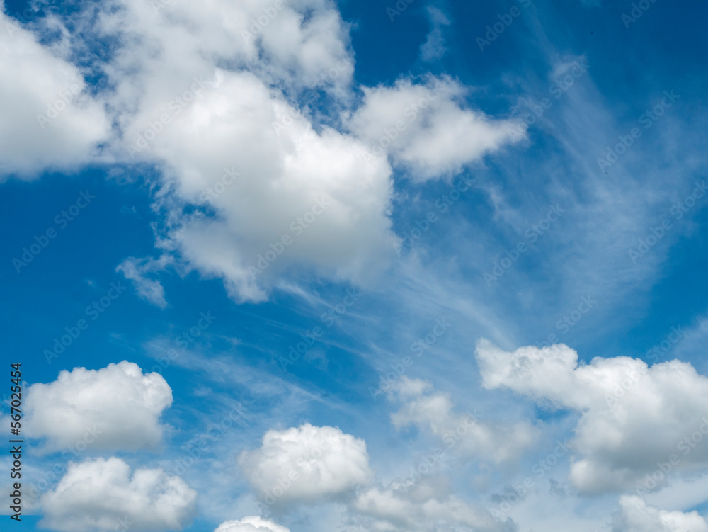 Blue sky fluffy white clouds on summer season bright clear skyline with beautiful cloudscape. Panorama blue sky clouds pattern on daylight with copy space. Cumulus cloudscape air climate sunny day Blue sky fluffy white clouds on summer season bright clear skyline with beautiful cloudscape. Panorama blue sky clouds pattern on daylight with copy space. Cumulus cloudscape air climate sunny day
