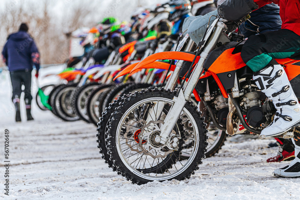 Fototapeta premium motorcycle wheels on start line winter motocross