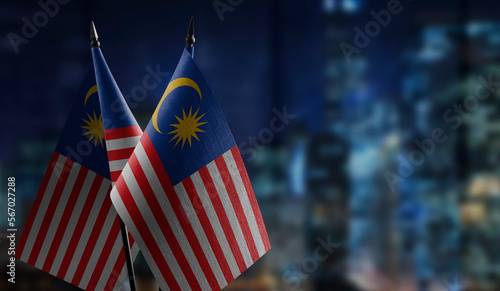 Small flags of the Malaysia on an abstract blurry background