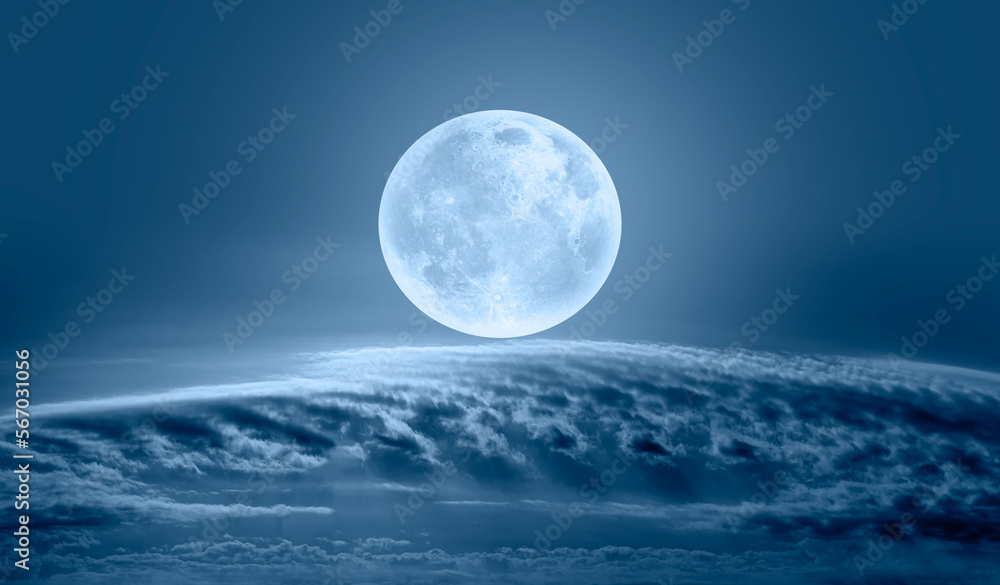 Night sky with full bright moon in the clouds 