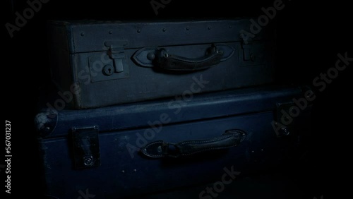 Suitcases Loaded Or Unloaded In Dark Area
