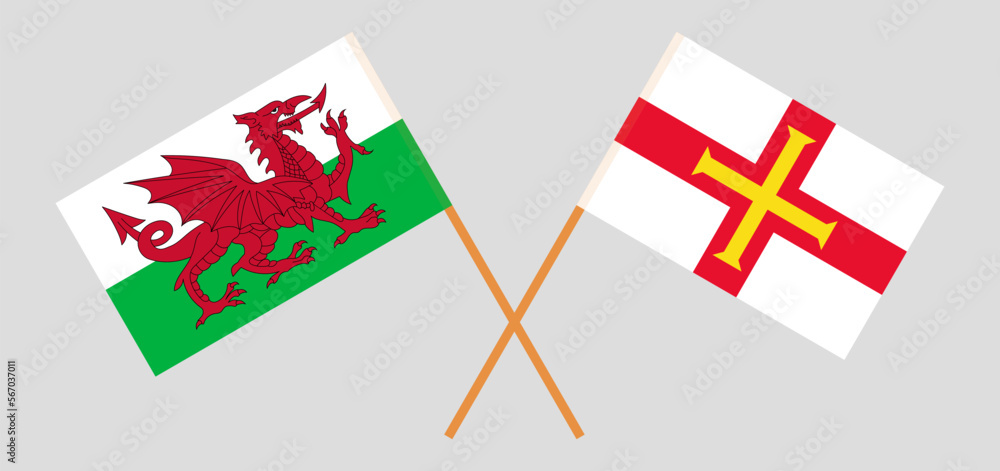 Crossed flags of Wales and Bailiwick of Guernsey. Official colors. Correct proportion
