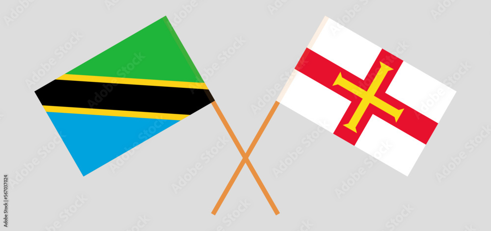 Crossed flags of Tanzania and Bailiwick of Guernsey. Official colors. Correct proportion