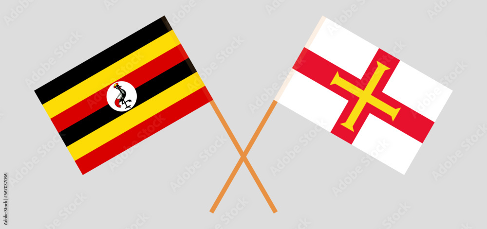 Crossed flags of Uganda and Bailiwick of Guernsey. Official colors. Correct proportion