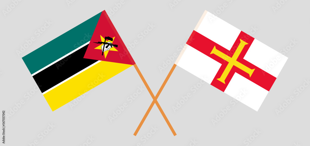 Crossed flags of Mozambique and Bailiwick of Guernsey. Official colors. Correct proportion