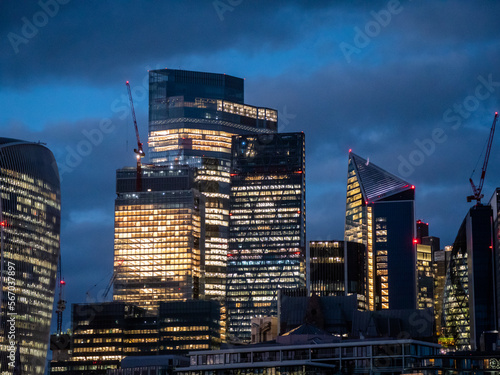 Bild auf Leinwand London, UK - City of London Financial District lit up at night with skyscrapers and office blocks early evening