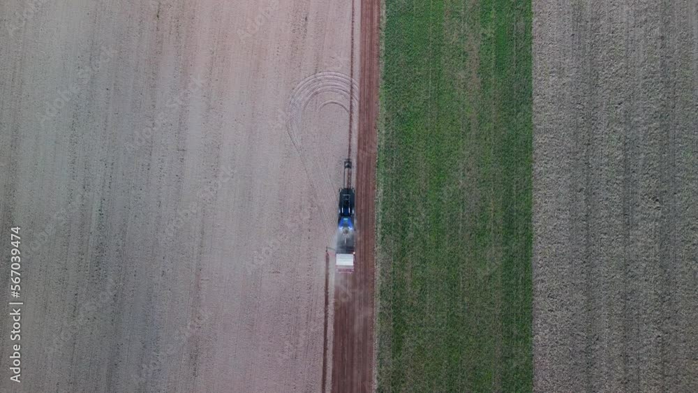 Tractor plows the fall field in germany. Spectacular aerial view flight drone Tractor plows the fall field in germany. Spectacular aerial view flight drone
