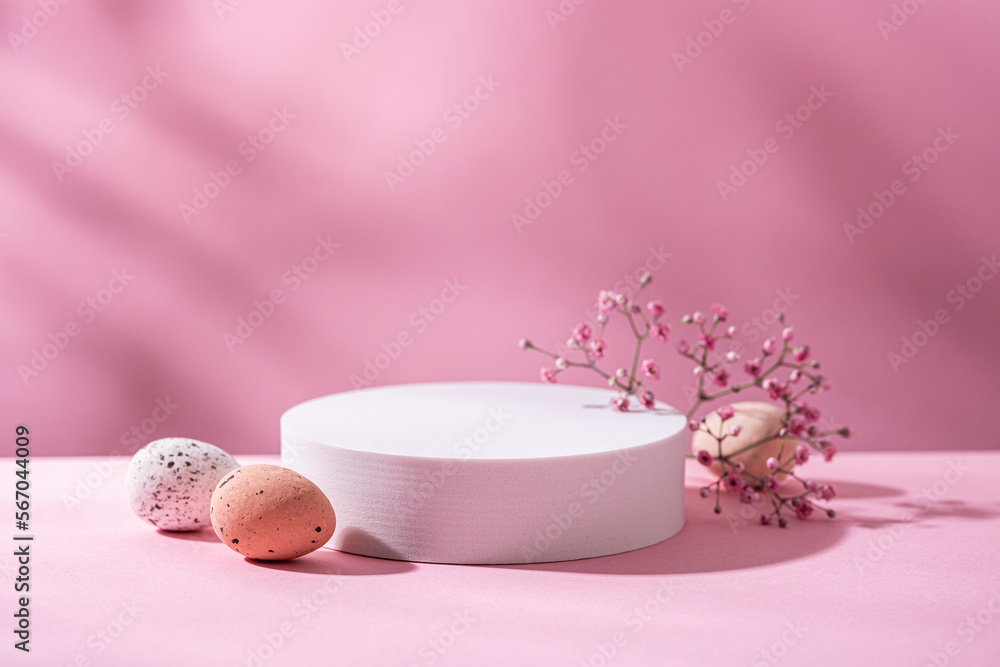 Abstract empty white podium with with Easter quail eggs and shadows on pink background. Mock up stand for product presentation. Minimal concept. Advertising template