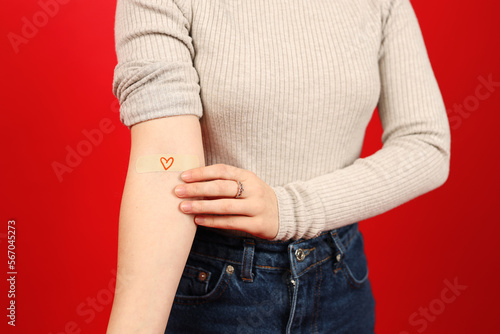 Canvas Print Close-up, a volunteer's hand with a band-aid after donating blood