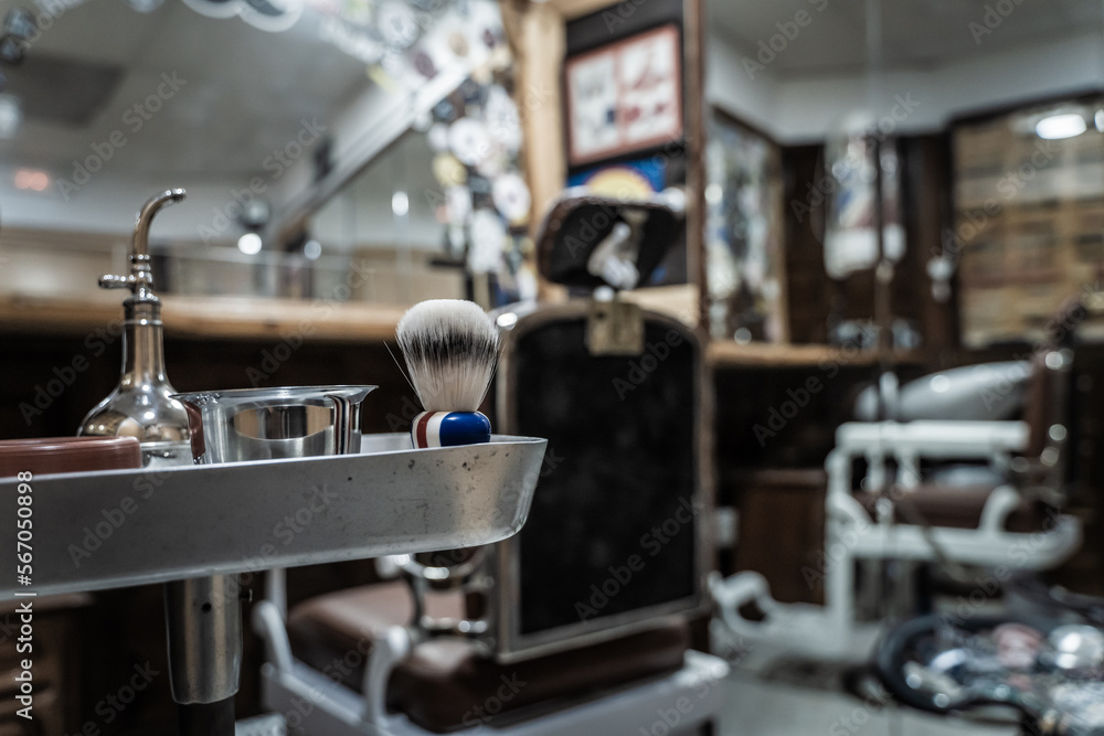 Empty barbershop with a plate with some barber tools Empty barbershop with a plate with some barber tools