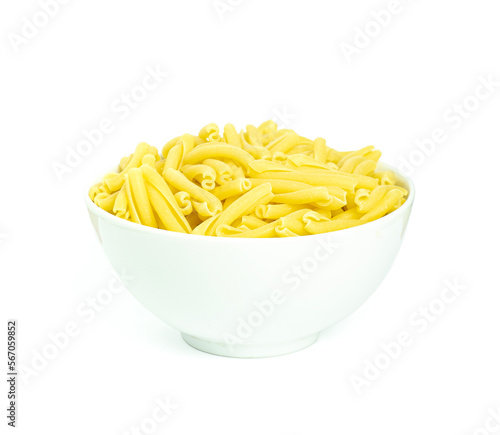 An image closeup isolated heap raw pasta in the bowl is italian food healthy on the white background with clipping path.