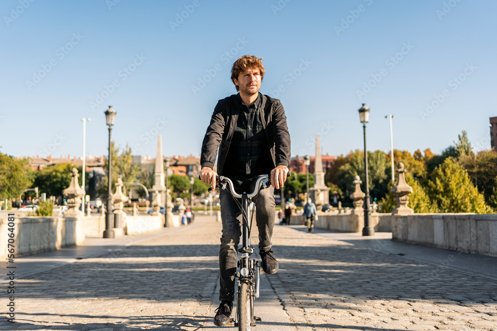 Man Riding Bike in Street Man Riding Bike in Street