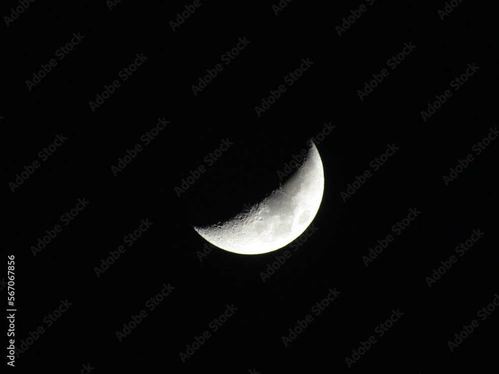 Crescent moon shining in the dark sky Crescent moon shining in the dark sky