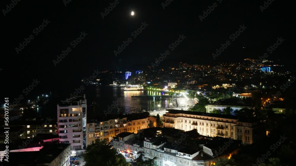 View of the Yalta Bay at night from the embankment in the Crimea View of the Yalta Bay at night from the embankment in the Crimea