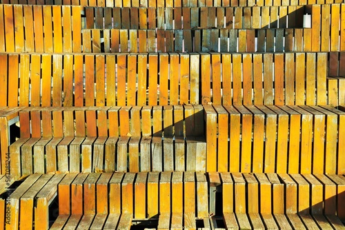 Background, texture of the stands of the street stadium finished with wooden planks