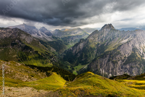 Mountain landscape with clouds and meadows in Allgau Alps, Germany