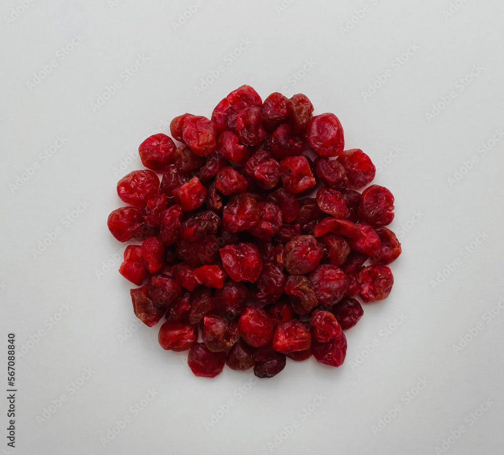 Dried cherries on white background. Copy space, top view, close-up. Dried cherries on white background. Copy space, top view, close-up.