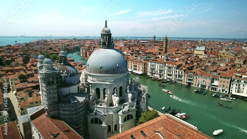 Drone Venice Italy 4k. Salute Basilica church, old architecture on Grand canal. Romantic honeymoon tourism landmark in Italy. Famous cruise destination in Europe. 