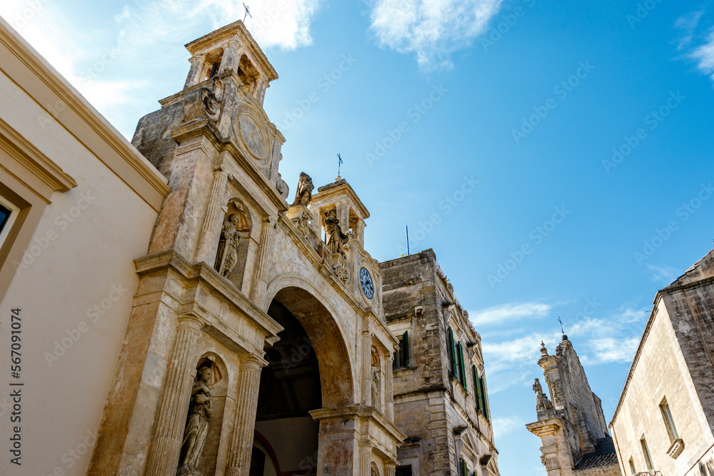 Exterior arch and towers of Palazzo del Sedile palace in Matera, Basilicata, Italy - Europe