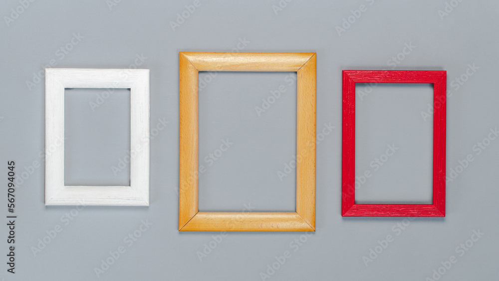 Set of empty wooden frames isolated over grey paper background Set of empty wooden frames isolated over grey paper background