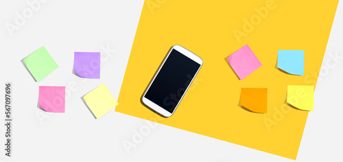 Smartphone with many colurful sticky notes from above