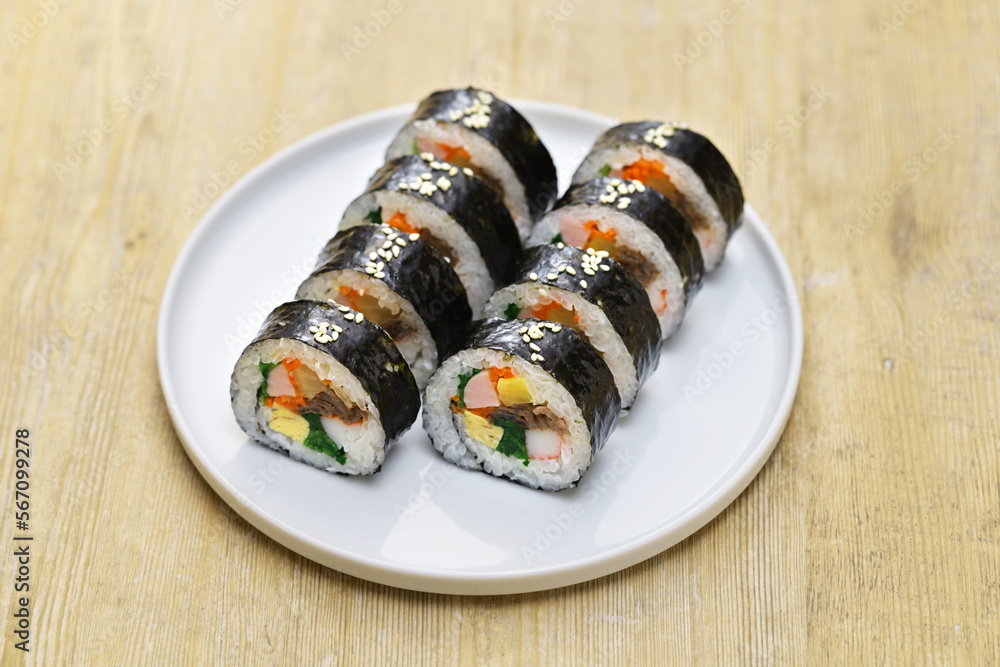 Gimbap is a Korean food consisting of rice and several ingredients seasoned with sesame oil and wrapped in nori seaweed. Gimbap is a Korean food consisting of rice and several ingredients seasoned with sesame oil and wrapped in nori seaweed.