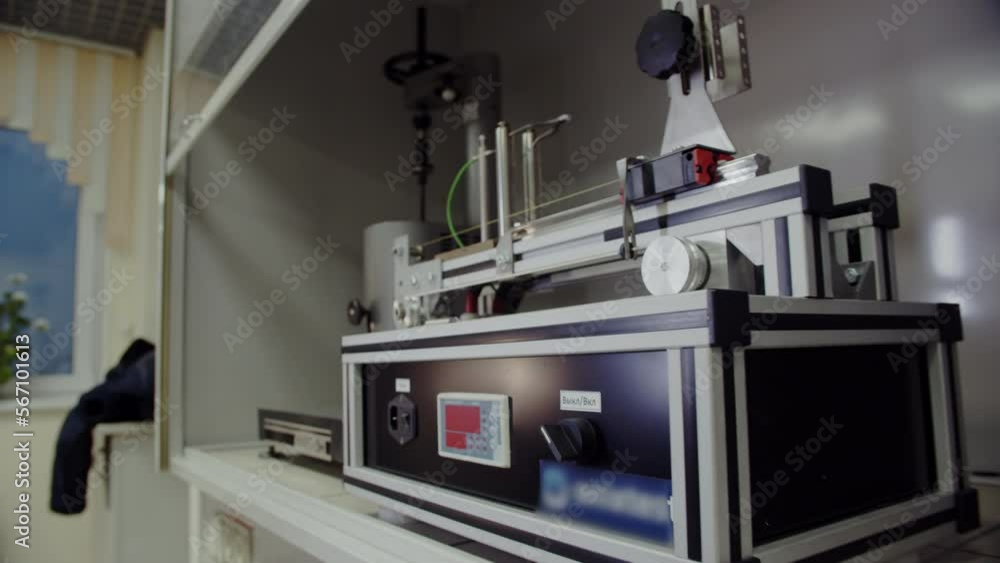 Steel apparatus for analysis of polymer materials. Laboratory for determination of physical and chemical parameters of raw materials and finished products closeup Steel apparatus for analysis of polymer materials. Laboratory for determination of physical and chemical parameters of raw materials and finished products closeup