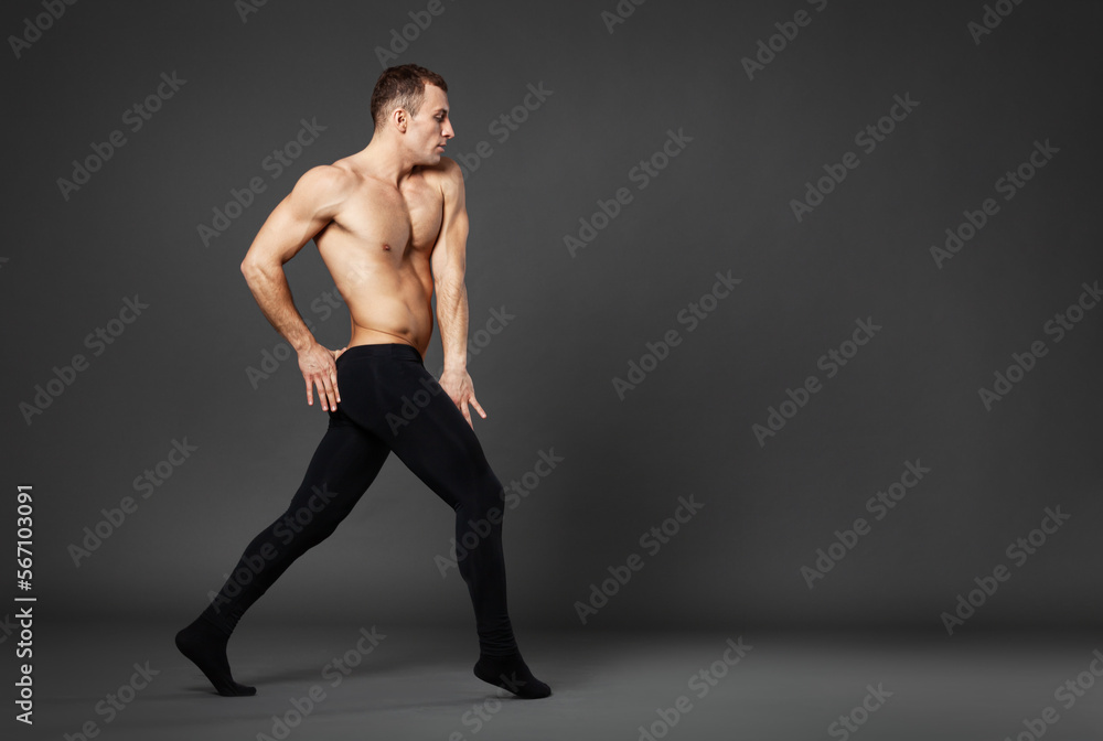 Portrait of a young ballet dancer dancing against a gray background. Portrait of a young ballet dancer dancing against a gray background.