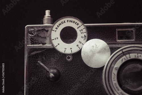 A close-up of a range finder camera (Argus Brick) - with the shutter button and Range Finder dial 