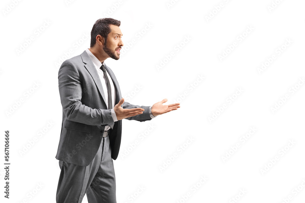 Angry businessman in a gray suit gesturing with hands Angry businessman in a gray suit gesturing with hands