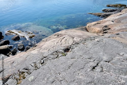 Wallpaper Mural rocky coastline, huge stone in the water Torontodigital.ca