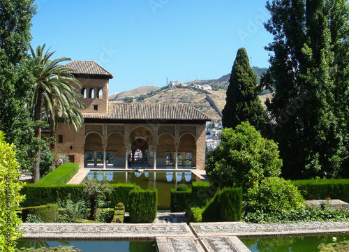 Beautiful view on the garden on a summer day. Alhambra. Granada. Spain.