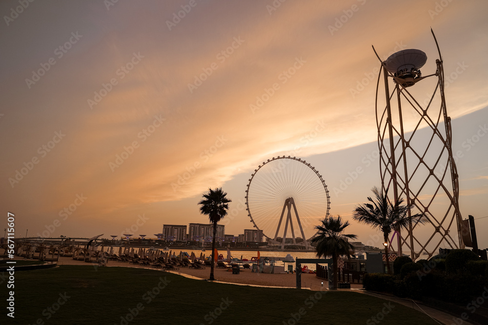 sunset colors over the sea view to the Ain Dubai,